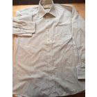 Стильная мужская рубашка Hallmark на 44-46 размер, 39 см горло. Красивый серый цвет в черную тонкую полоску. Длина 75 см, длина рукава 59 см, ПОгруди 54 см. Б/у в хорошем состоянии.