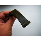 Бронзовый слиток со следами рубки. Выполнял функцию примитивных денег. Кельты.