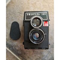 Фотоапарат ''Любитель 166'' олимпийской серии с чехлом и ремешком.