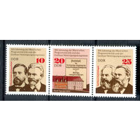 ГДР - 1975г. - Вильгельм Либкнехт, Август Бебель, Карл Маркс, Фридрх Энгельс - 3 марки - сцепка - полная серия, MNH, с незначительным дефектом клея [Mi 2050-2052]. #O-Se-Z-1-35