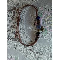 Браслет с бусинами и слоником