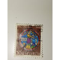 Марка Швейцария 1968 год Знак зодиака Весы (Libra), изображенный на основе витража собора Лозанны.