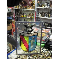 Испанский герб эмалью на стекле в алюминиевой рамке 28х20,5 см.