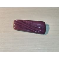 Брошь из тяжёлого плотного пластика, размер 6*2.3 см.