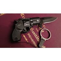 Нож брелок. Пистлет. Не точен, отличный брелок для ключей.