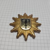 Кокарда на головной убор Федеральной полиции Германии.