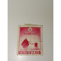 Япония 1936 год На марке изображены "Супружеские скалы" Меото Ива в Футамигауре, связанные священной веревкой.