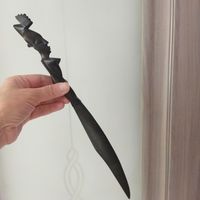 Нож. Предположительно для бумаги. Резьба. Твердое,темное дерево. 35х3,8 см.