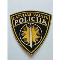 Шеврон 0227, Латвия