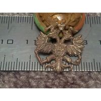 Знак, эмблема на петлицу, погон или эполет.