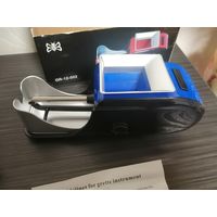 Электрическая машинка для набивки сигарет.